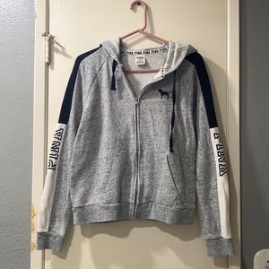 Pink black and white zip up sweater